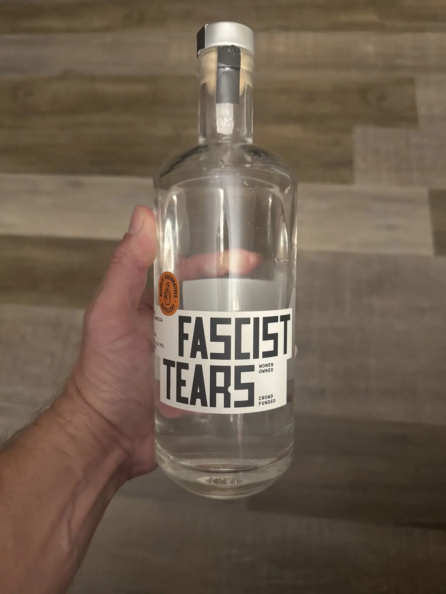 A bottle of alcohol labelled "Fascist Tears"